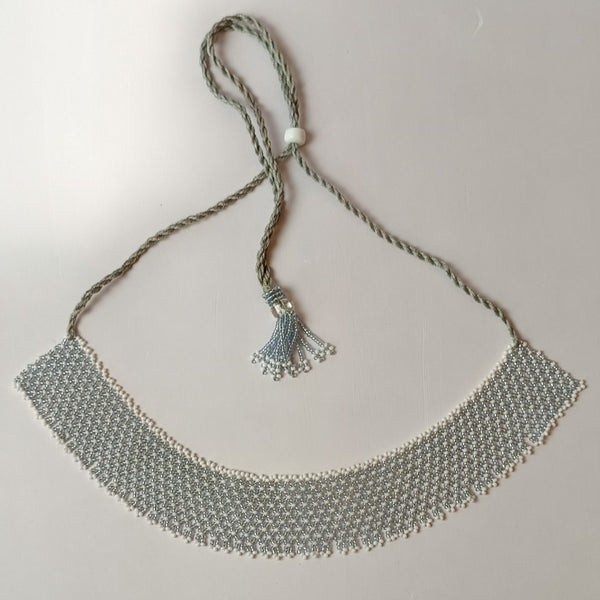 Anvi Shah's Beaded Necklace: White and Silver