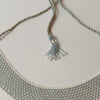 Anvi Shah's Beaded Necklace: White and Silver