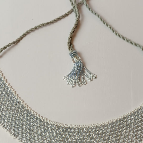 Anvi Shah's Beaded Necklace: White and Silver
