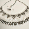 Anvi Shah's Beaded Necklace: White and Grey