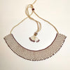 Anvi Shah's Beaded Necklace: White and Maroon